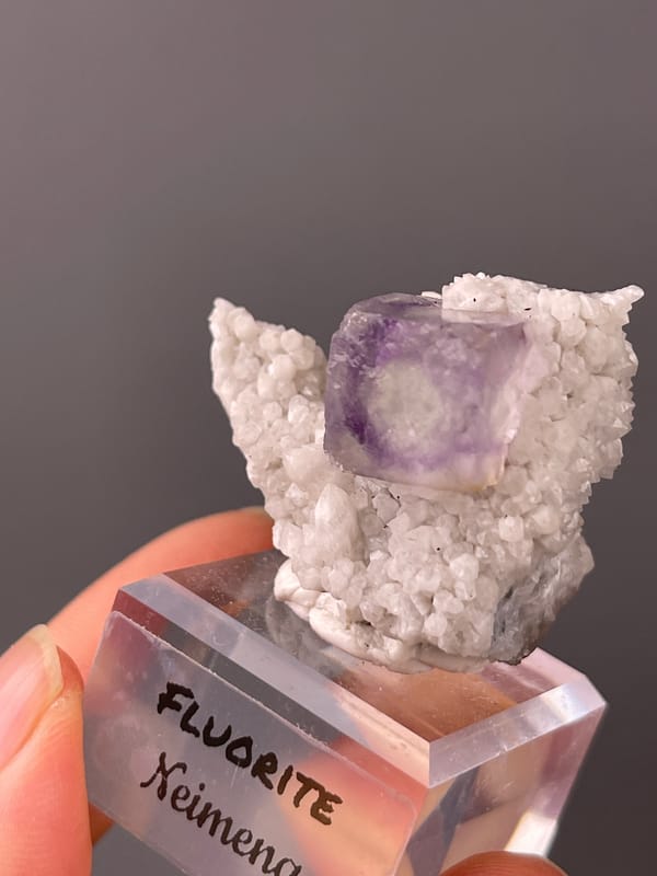 Purple zoned cube on white matrix visible on purple phantom fluorite specimen from Inner Mongolia, China