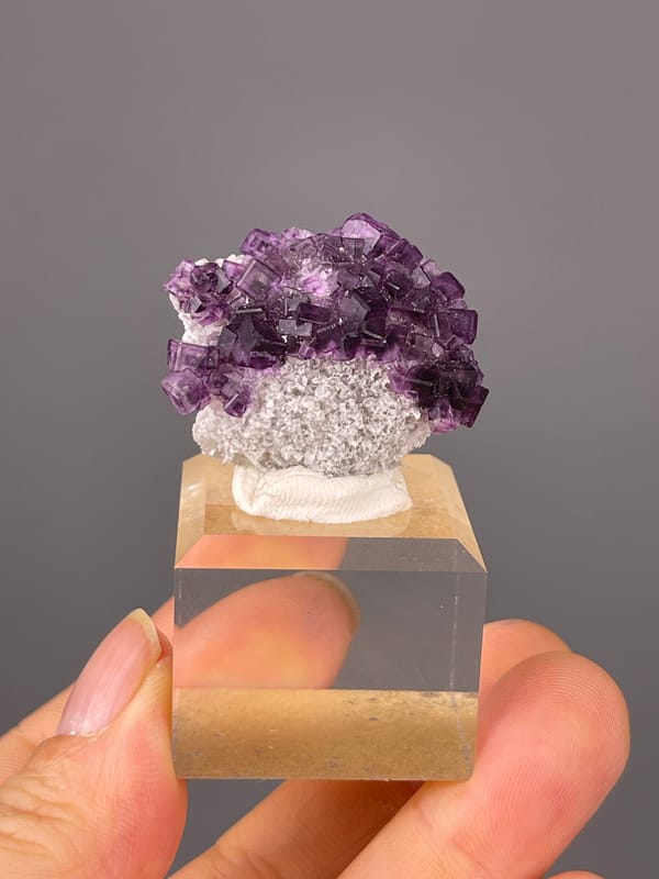 Purple Zoned Fluorite specimen from Zhejiang, China featuring stepped purple cubic crystals