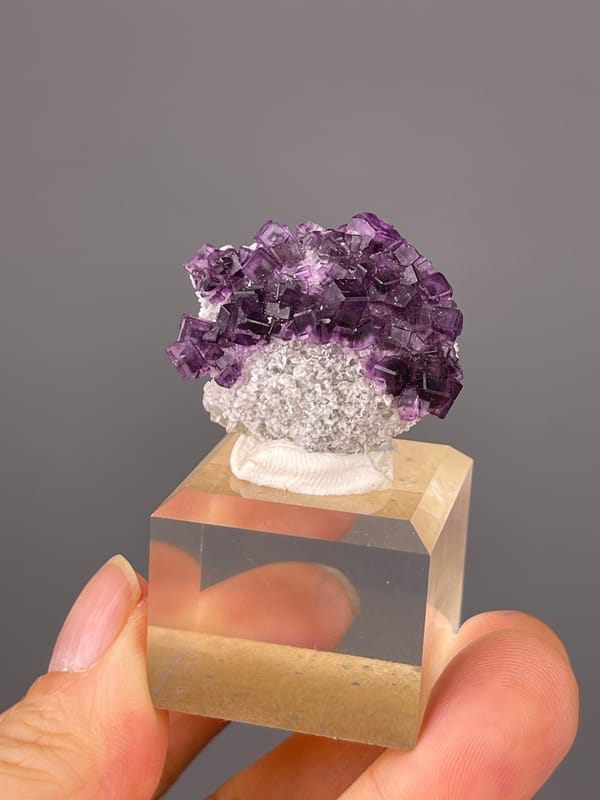 Purple Zoned Fluorite specimen from Zhejiang, China showing stepped purple cubic crystals