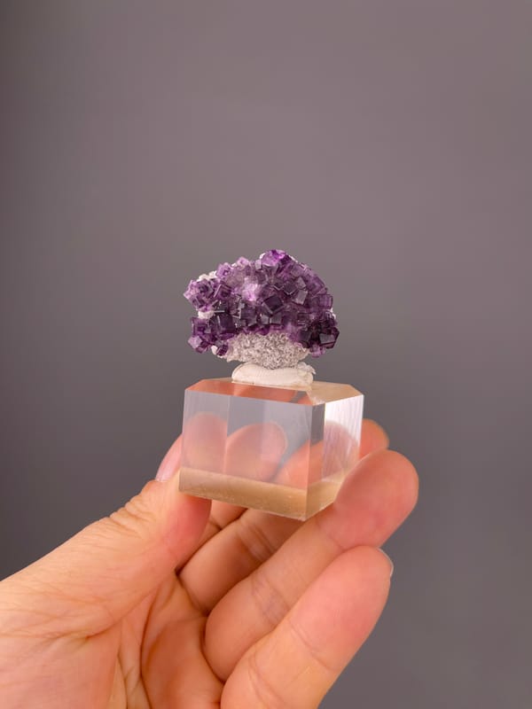 Purple Zoned Fluorite specimen from Zhejiang, China displaying stepped purple cubic crystals