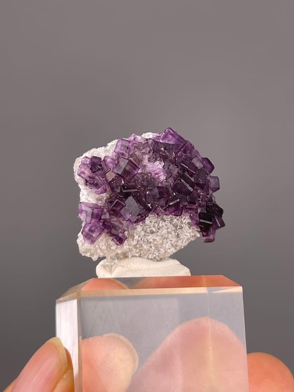Purple Zoned Fluorite specimen from Zhejiang, China highlighting stepped purple cubic crystals