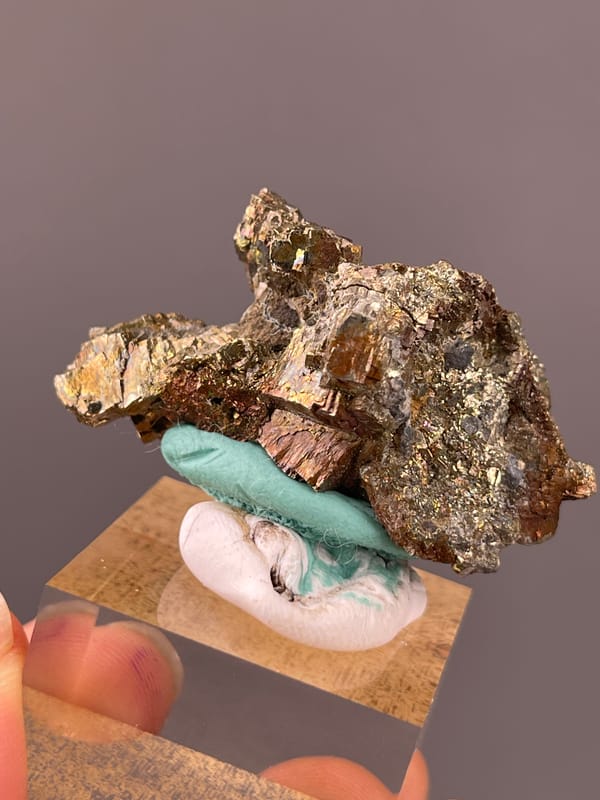 Pyrite specimen from Longyan, Fujian, China highlighting coppery-brown tarnished metallic crystals