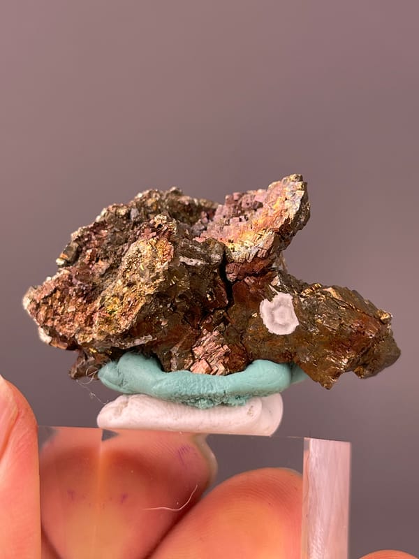 Pyrite specimen from Longyan, Fujian, China showcasing coppery-brown tarnished metallic crystals