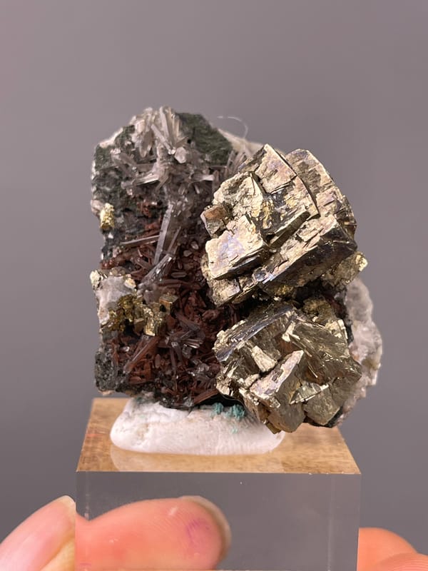 Pyrite specimen from Longyan, Fujian, China featuring striated silver-brassy blocky crystals