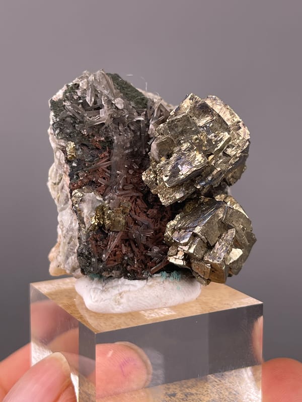 Pyrite specimen from Longyan, Fujian, China, defined by striated silver-brassy blocky crystals