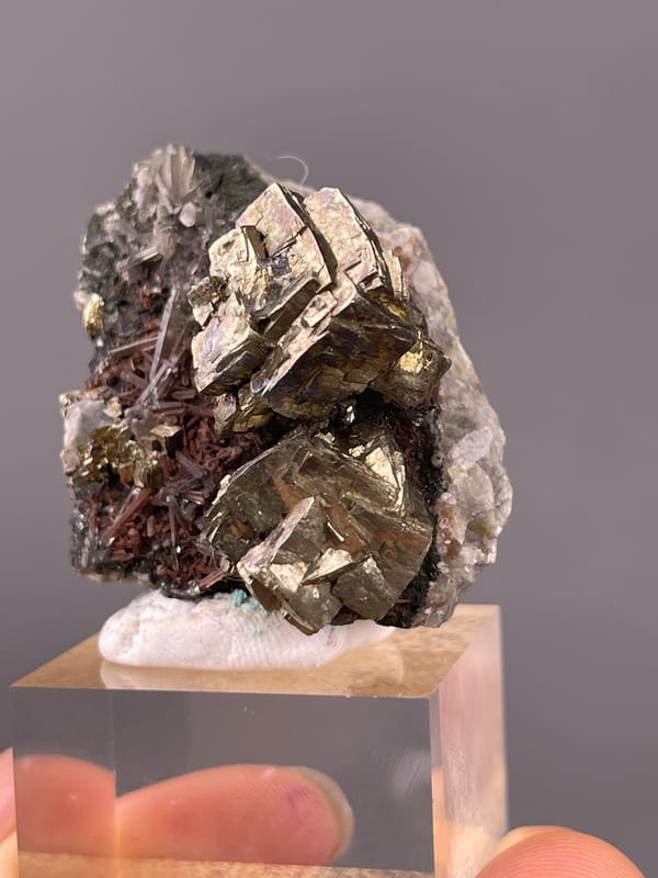 Pyrite specimen from Longyan, Fujian, China presenting striated silver-brassy blocky crystals