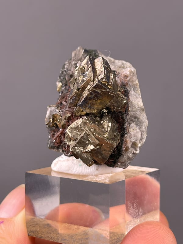 Striated silver-brassy blocky crystals visible on pyrite specimen from Longyan, Fujian, China