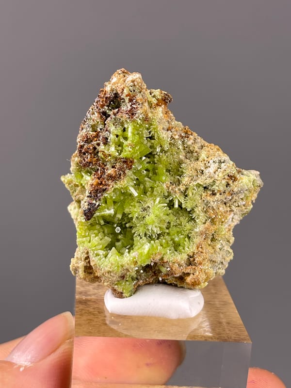 Pyromorphite specimen from Guangxi, China presenting lime-green hexagonal cavity crystals