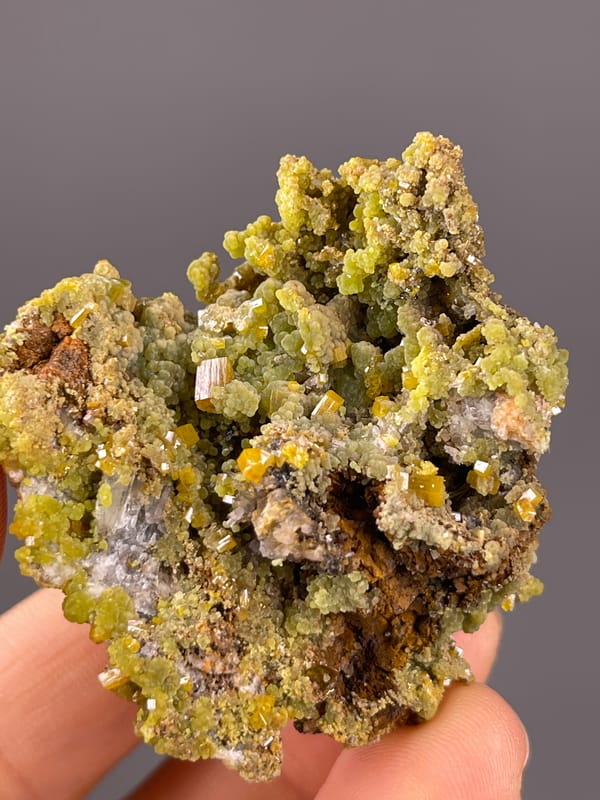 Olive hexagonal crystal cluster visible on pyromorphite specimen from Guangxi, China