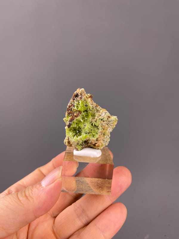 Pyromorphite specimen from Guangxi, China showcasing lime-green hexagonal cavity crystals