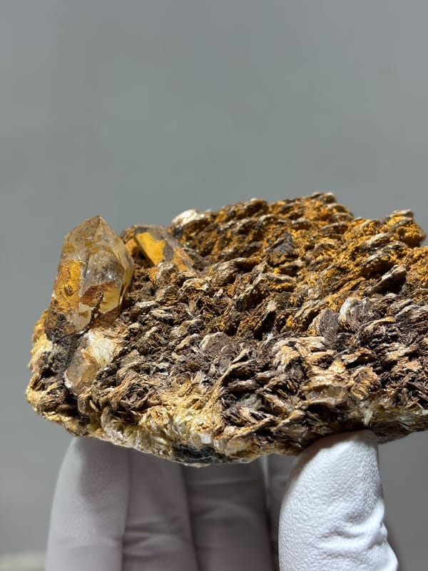 Brown mica plate with small quartz crystals from Xuebaoding, Sichuan, China, second angle