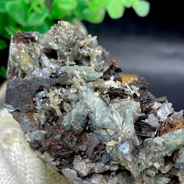 Pale green quartz needles with specular hematite from Inner Mongolia, China, view 4 of 9