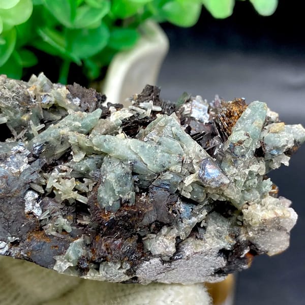 Pale green quartz needles with specular hematite from Inner Mongolia, China, view 8 of 9