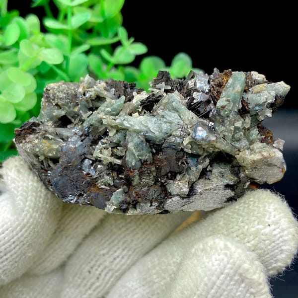 Pale green quartz needles with specular hematite from Inner Mongolia, China, view 9 of 9