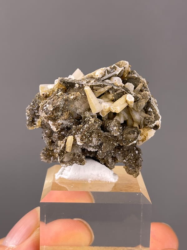 Quartz specimen showing cream crystals over dark sulfides distinctly