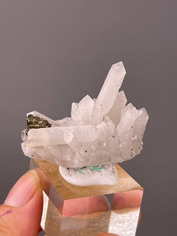 White quartz cluster with brassy crystals visible on quartz specimen from Longyan, Fujian, China