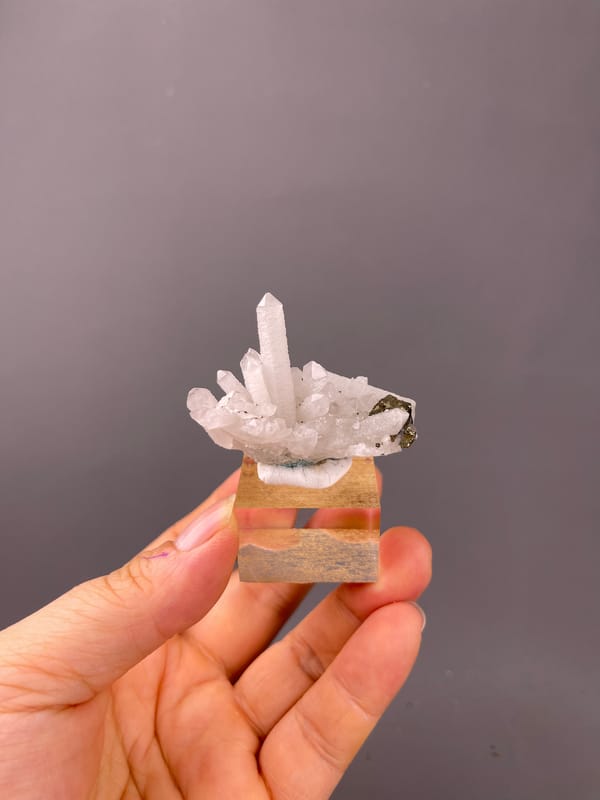 Quartz specimen from Longyan, Fujian, China, characterized by white quartz cluster with brassy crystals
