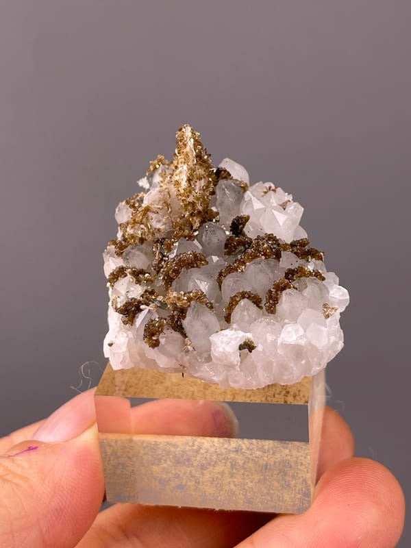 Quartz specimen from Longyan, Fujian, China featuring white quartz with brown coating