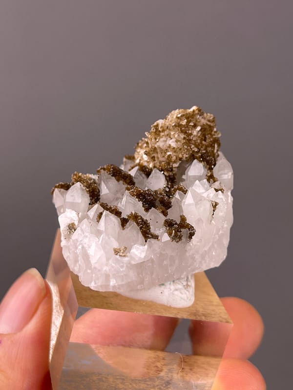 White quartz with brown coating visible on quartz specimen from Longyan, Fujian, China