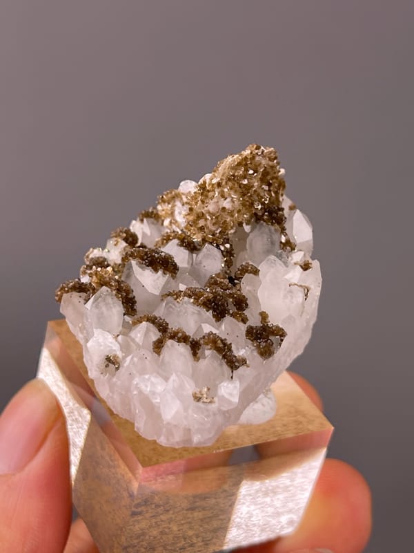 Quartz specimen from Longyan, Fujian, China displaying white quartz with brown coating