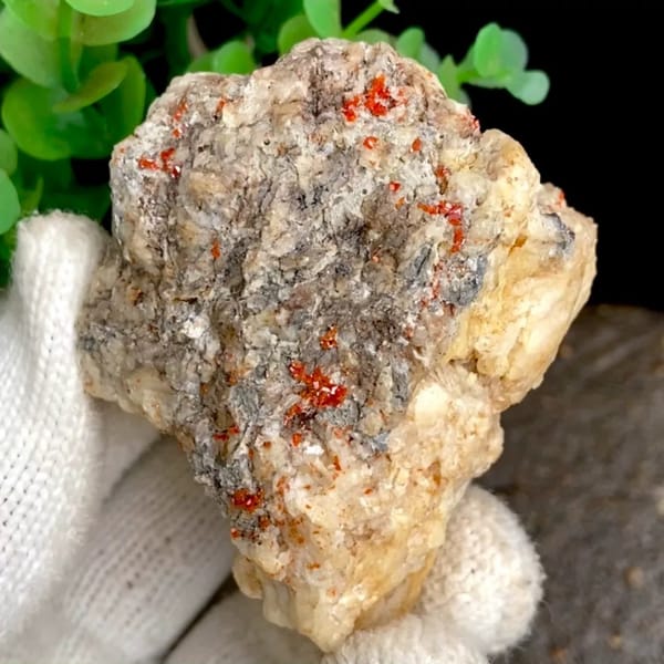 Red wulfenite spots over pale matrix block from Sichuan, China