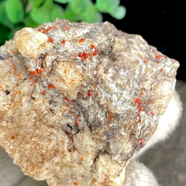 Red wulfenite spots over pale matrix block from Sichuan, China, view 6 of 9