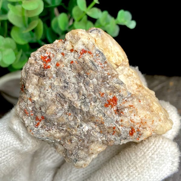 Red wulfenite spots over pale matrix block from Sichuan, China, view 7 of 9