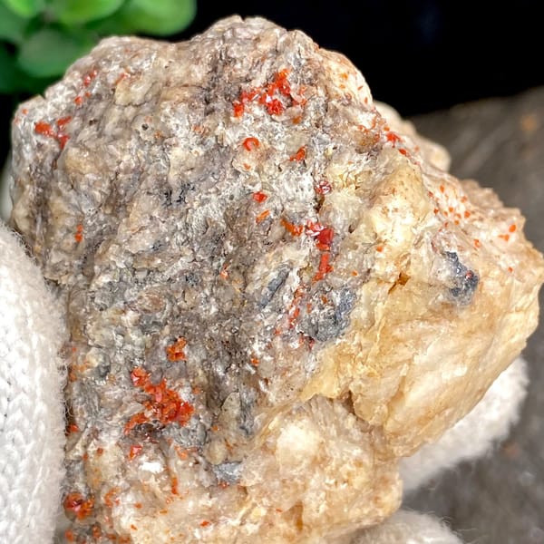 Red wulfenite spots over pale matrix block from Sichuan, China, view 8 of 9