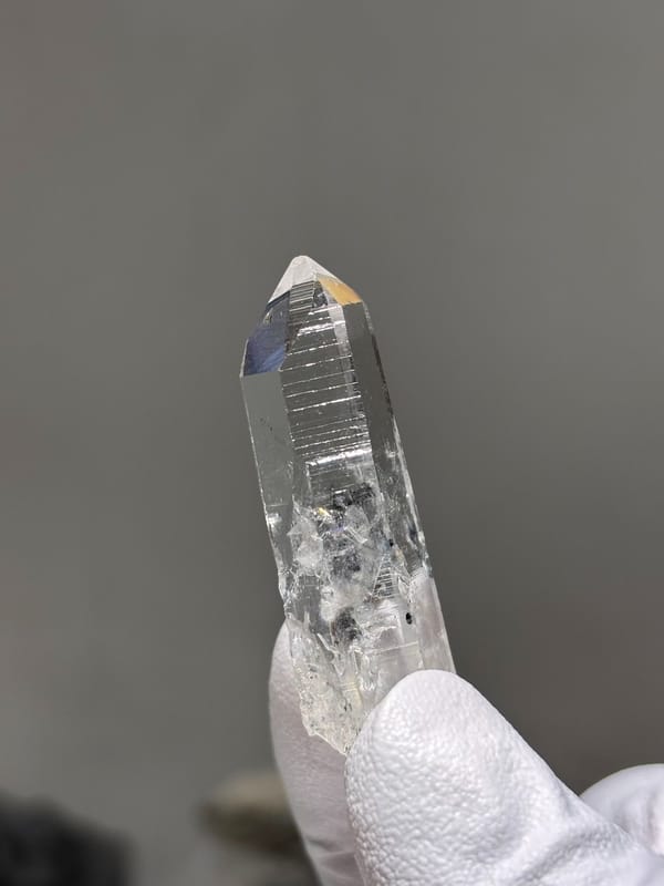 Reference-grade clear quartz point with tip pattern from Jinkouhe, Sichuan, China