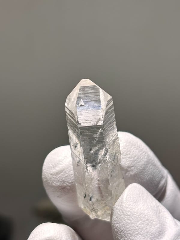 Reference-grade clear quartz point with tip pattern from Jinkouhe, Sichuan, China, view 2 of 7
