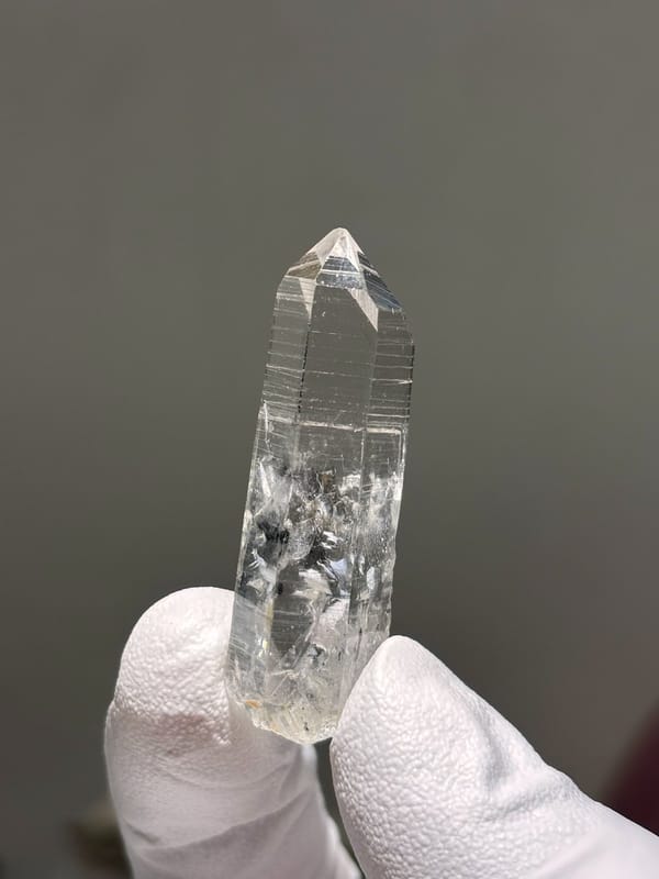 Reference-grade clear quartz point with tip pattern from Jinkouhe, Sichuan, China, view 3 of 7