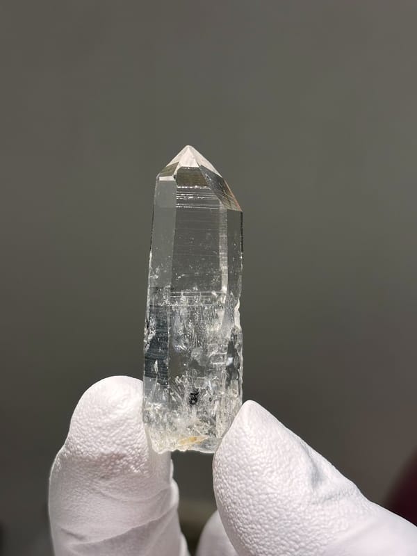 Reference-grade clear quartz point with tip pattern from Jinkouhe, Sichuan, China, view 4 of 7