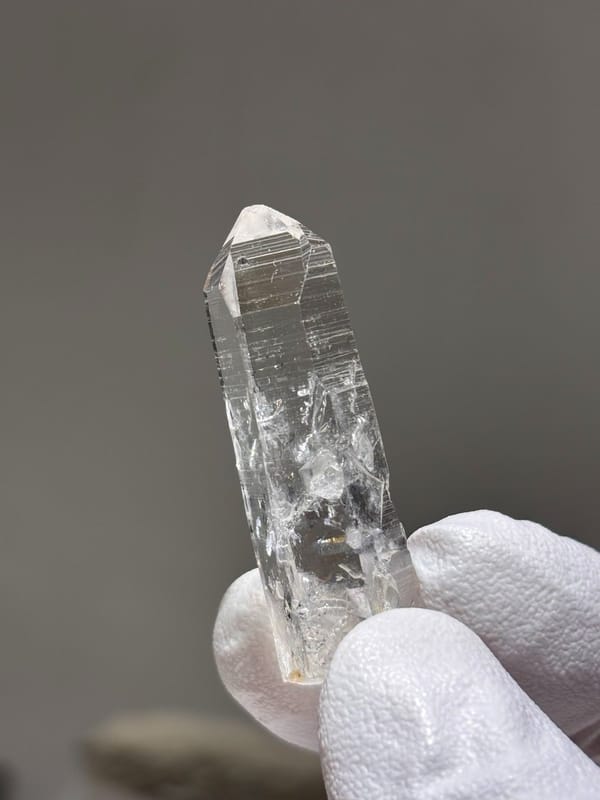 Reference-grade clear quartz point with tip pattern from Jinkouhe, Sichuan, China, view 5 of 7