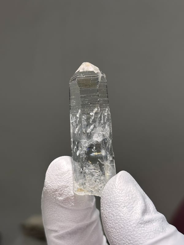 Reference-grade clear quartz point with tip pattern from Jinkouhe, Sichuan, China, view 6 of 7