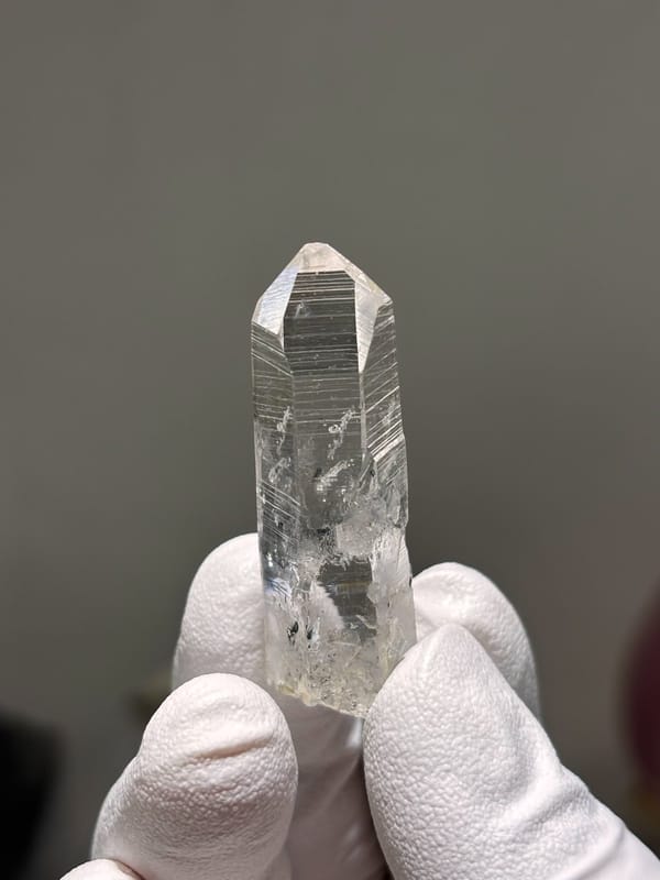 Reference-grade clear quartz point with tip pattern from Jinkouhe, Sichuan, China, view 7 of 7