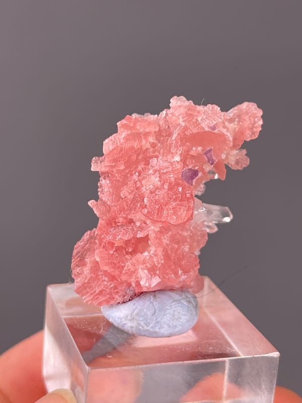 Rhodochrosite specimen from Guangxi, China, defined by pink carbonate cluster with clear quartz