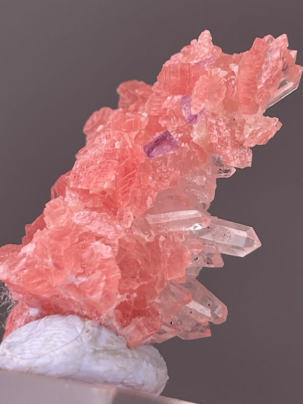 Rhodochrosite specimen from Guangxi, China displaying pink carbonate cluster with clear quartz