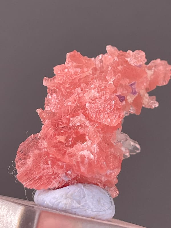 Pink carbonate cluster with clear quartz on natural rhodochrosite specimen from Guangxi, China