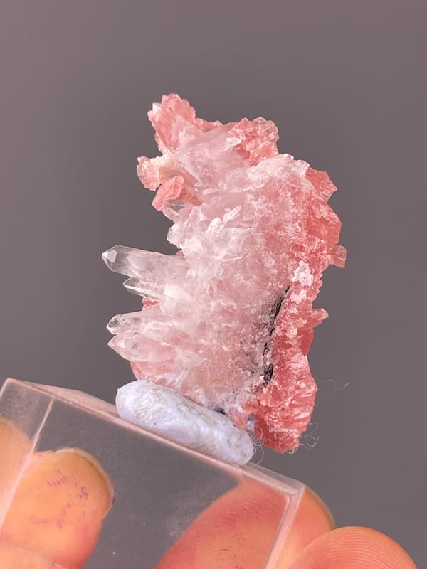 Rhodochrosite specimen from Guangxi, China, characterized by pink carbonate cluster with clear quartz