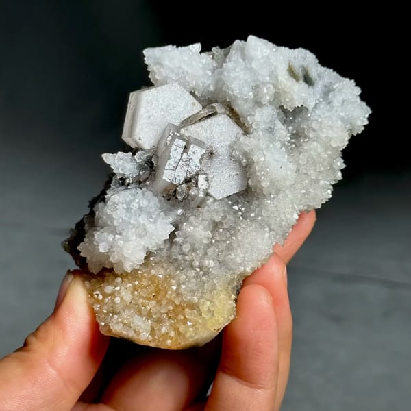 Hexagonal sandwich calcite plates on yellow-stained quartz from Fujian, China, view 5 of 11