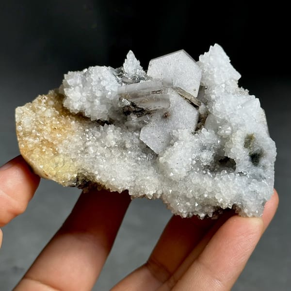 Hexagonal sandwich calcite plates on yellow-stained quartz from Fujian, China, view 6 of 11