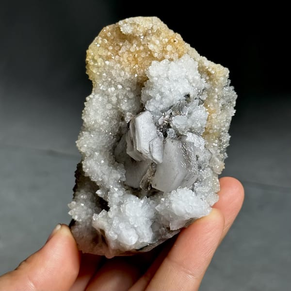 Hexagonal sandwich calcite plates on yellow-stained quartz from Fujian, China, view 7 of 11