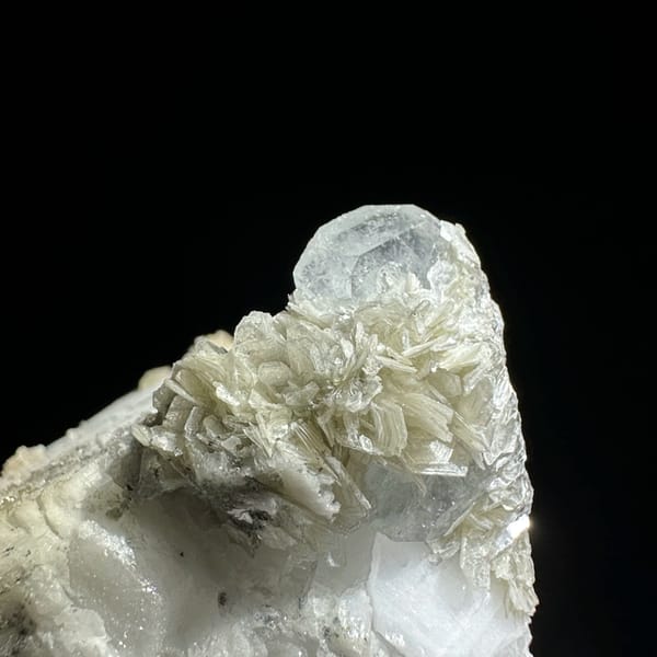 Large feldspar crystal with scheelite, aquamarine and muscovite from Xuebaoding, Sichuan, China, top view