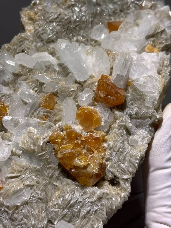 Mica plate with scheelite, aquamarine and fluorite from Xuebaoding, Sichuan, China, reverse side
