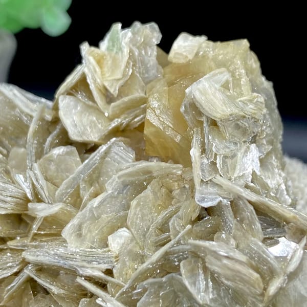 Honey scheelite crystal on silvery mica blades from Sichuan, China, view 4 of 9