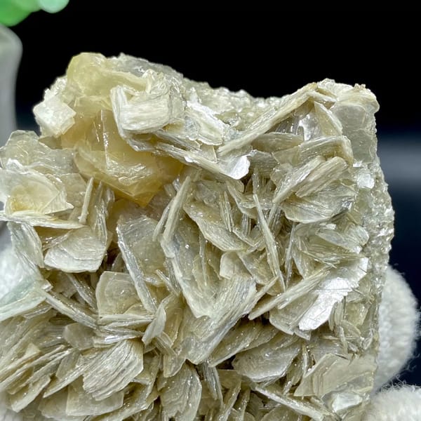 Honey scheelite crystal on silvery mica blades from Sichuan, China, view 6 of 9