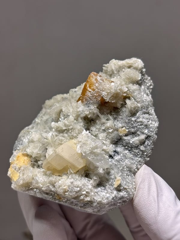 Scheelite plate with quartz, aquamarine and mica from Xuebaoding, Sichuan, China
