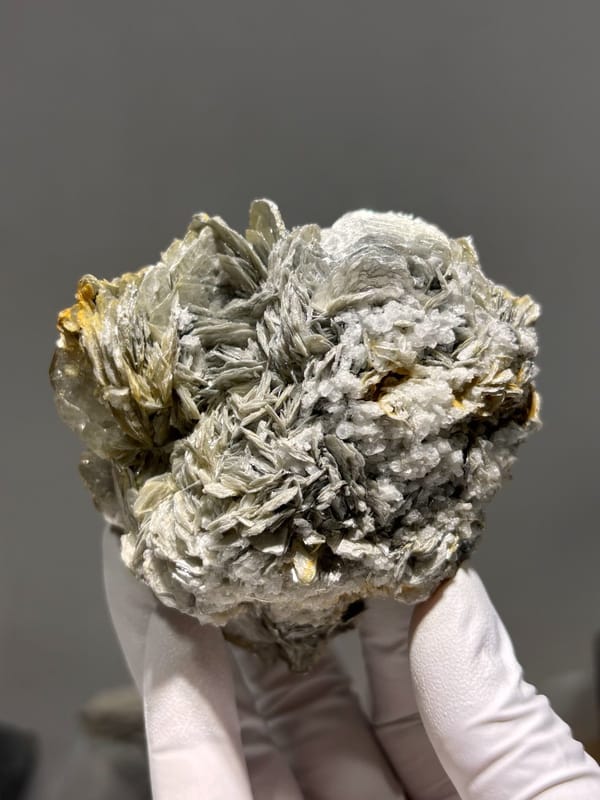Cluster of silvery mica rosettes with aquamarine from Xuebaoding, Sichuan, China, view 2 of 5
