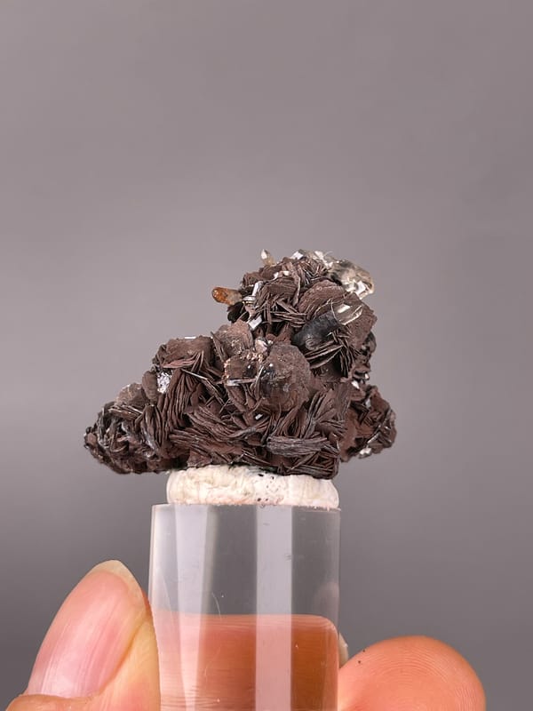 Specular Hematite specimen from Jinlong, Guangdong, China featuring dark radial hematite rosettes