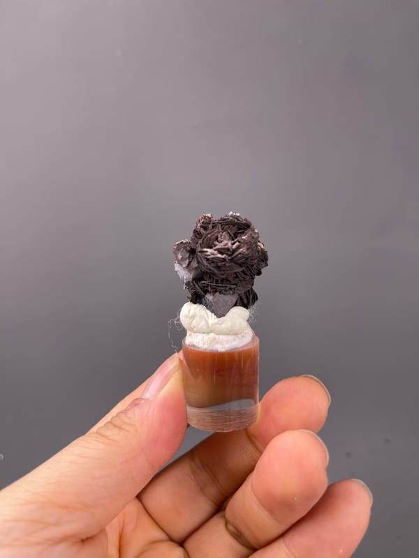 Specularite specimen from Jinlong, Guangdong, China showcasing dark bladed specularite rosette